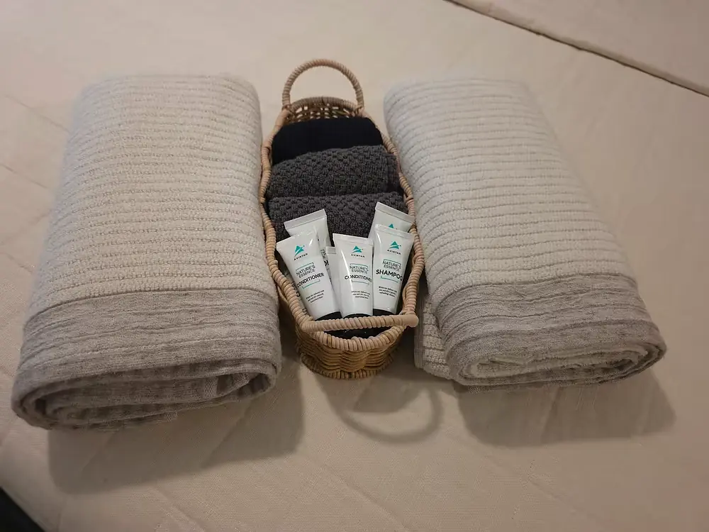 basket of towels in bedroom 3